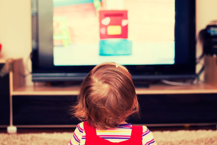 child in front of TV