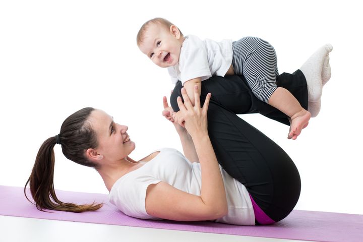 mom with baby doing gymnastics and fitness exercises